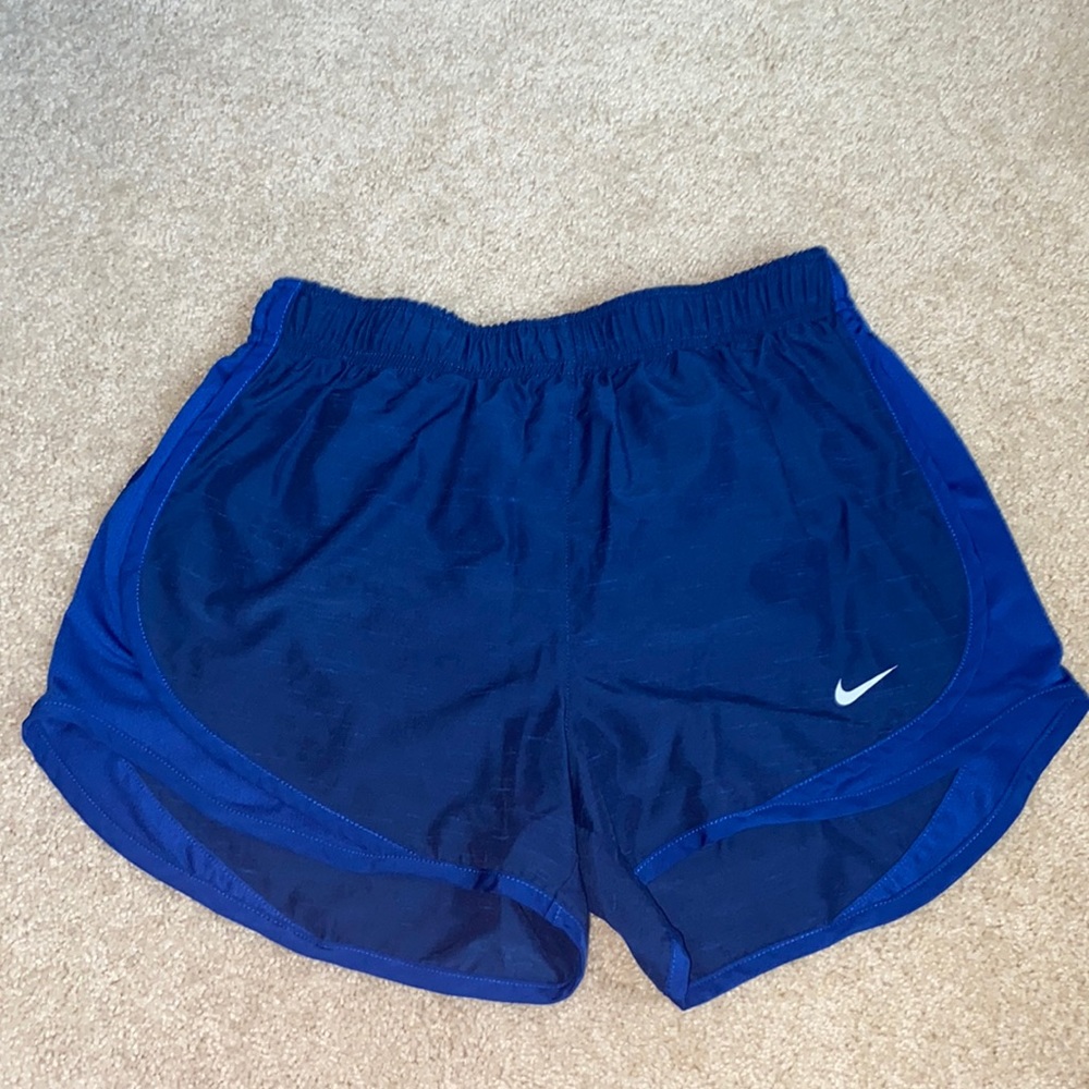Blue Nike running shorts